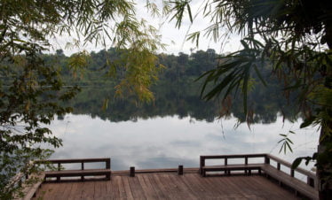 banlung-cambodia-view-of-yeak-lom-lake-with-wooden-platform-in-foreground-116077983