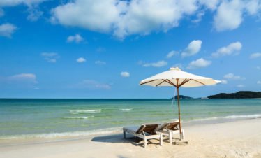 relaxing-chair-with-umbrella-on-the-beach-in-nha-trang-vietnam-72399237