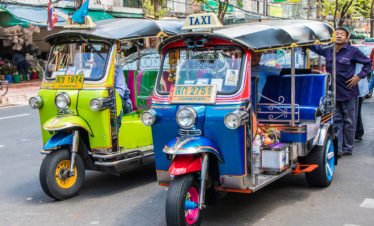 tuk-tuks-and-their-drivers-thailand-129402347
