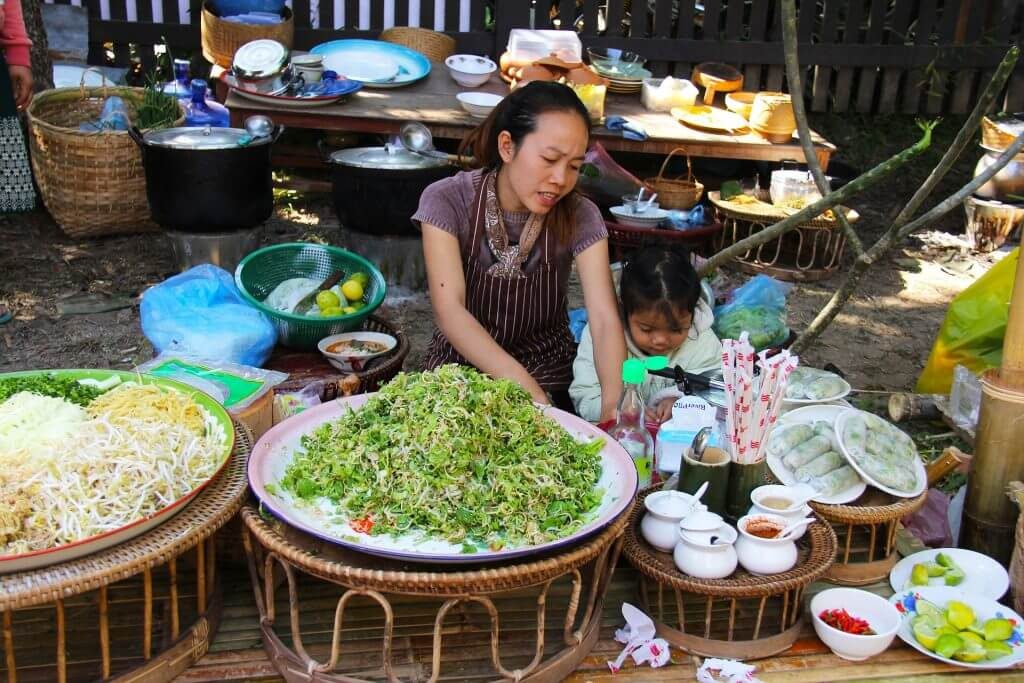 Asian lady making traditional food